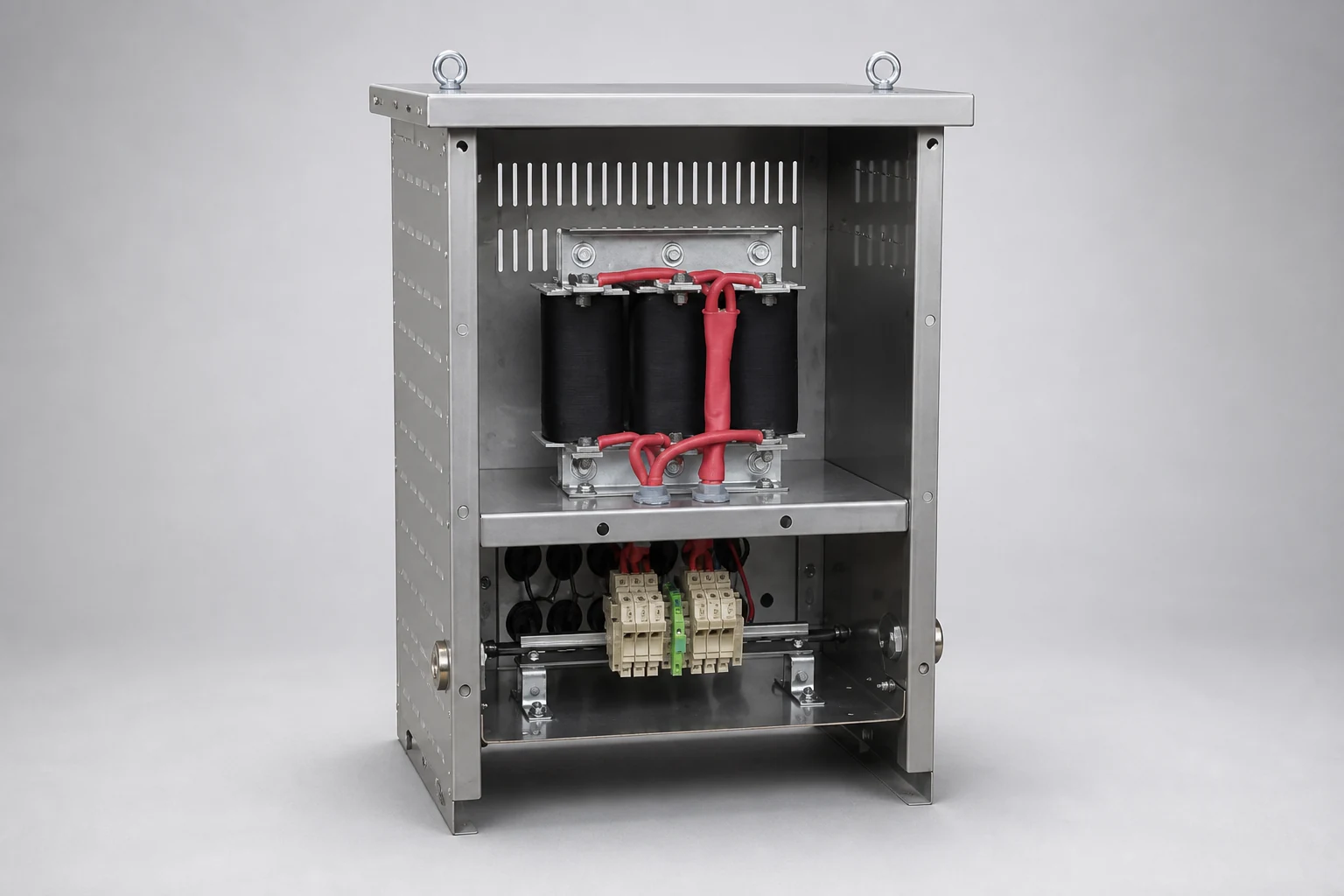 dv/dt filter in an open stainless-steel enclosure seen from the left, with three filter coils above the terminal blocks