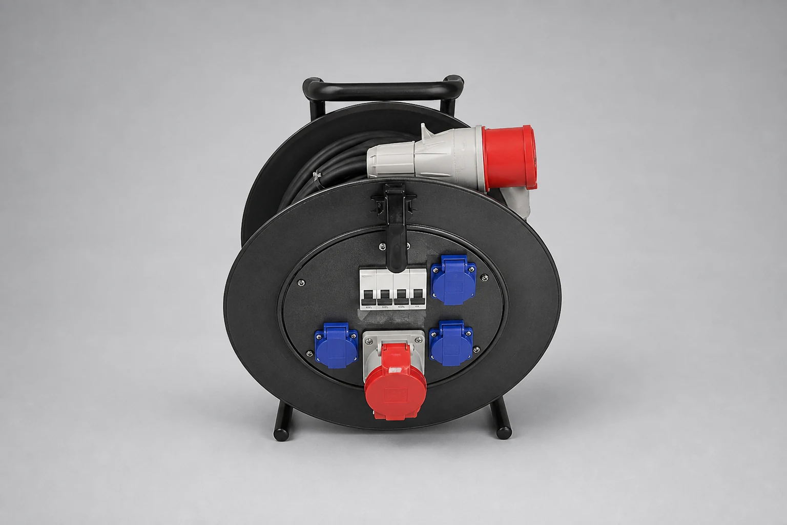 Three-phase power cable on a reel with red CEE plug, circuit breakers, red CEE socket and three single-phase sockets