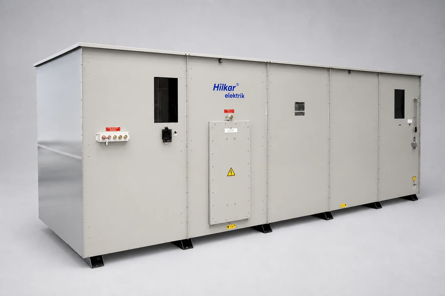 Hilkar metal-enclosed MV capacitor bank with segmented gray enclosure, inspection windows and service doors